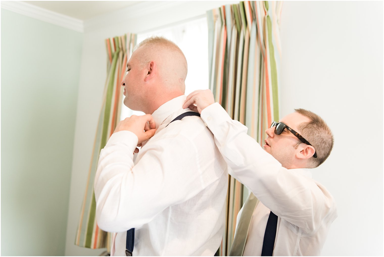 Groom getting ready at Beachwalk Hotel