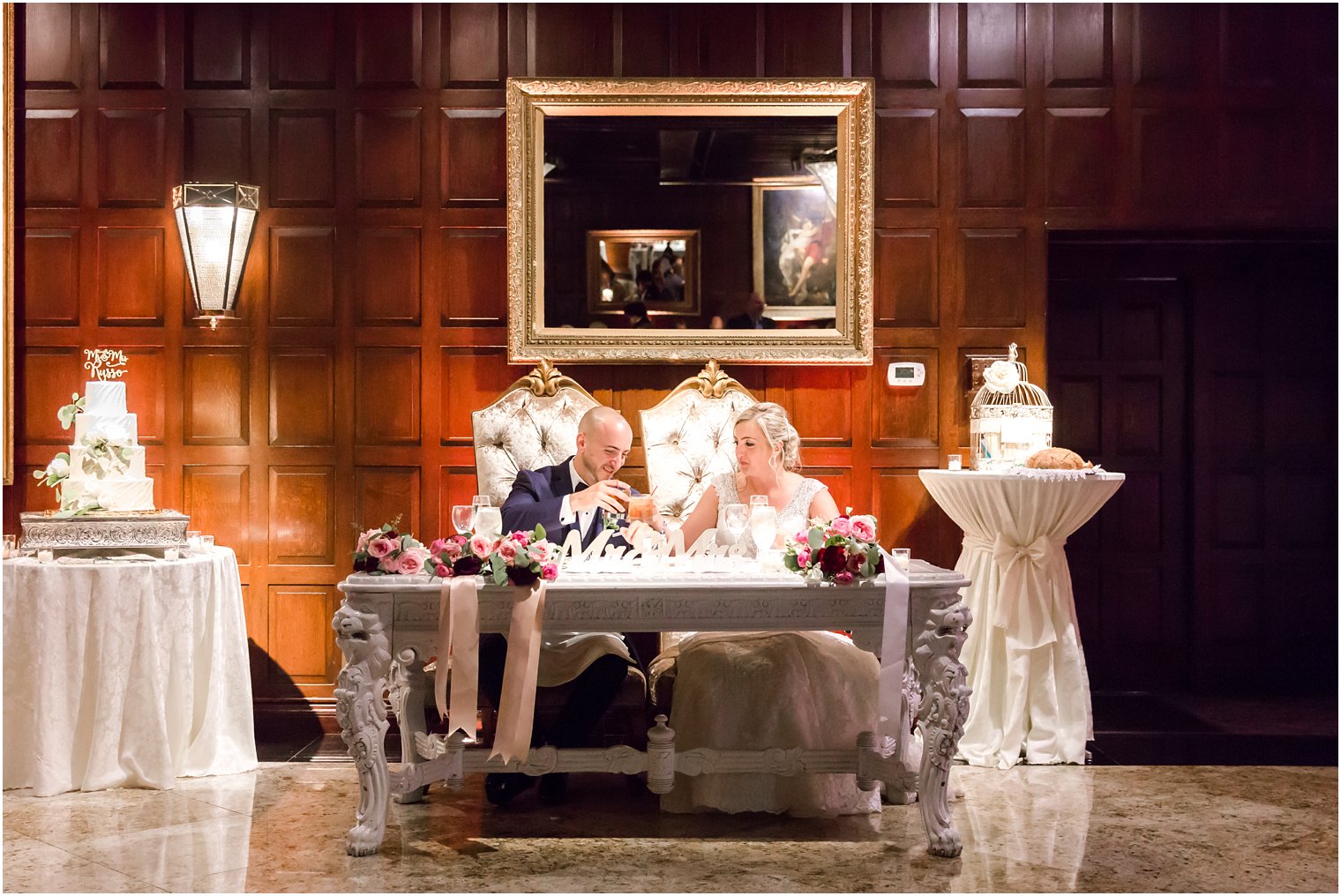 Bride and groom at Sweetheart table in Shadowbrook wedding photos
