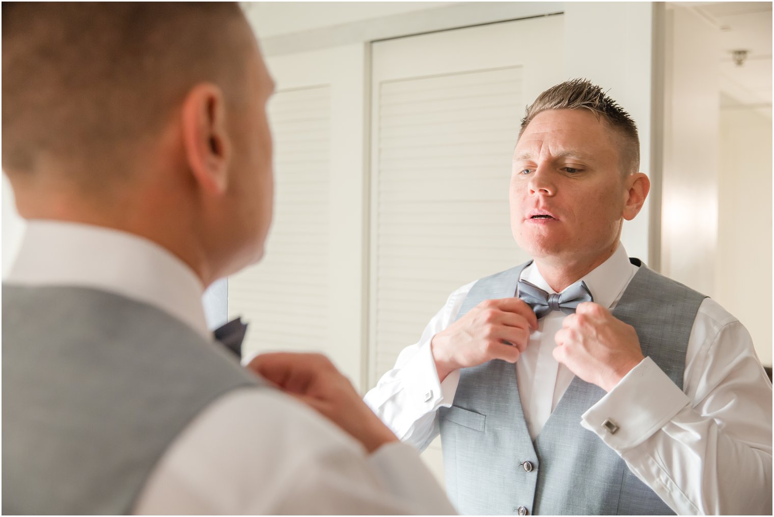 Groom with gray bow tie | Idalia Photography