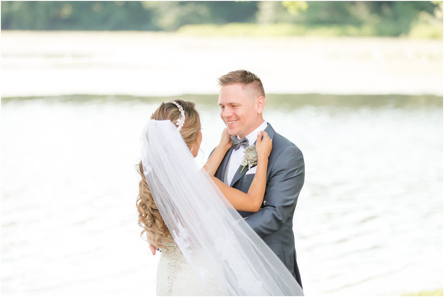 Bride and groom first look near lake