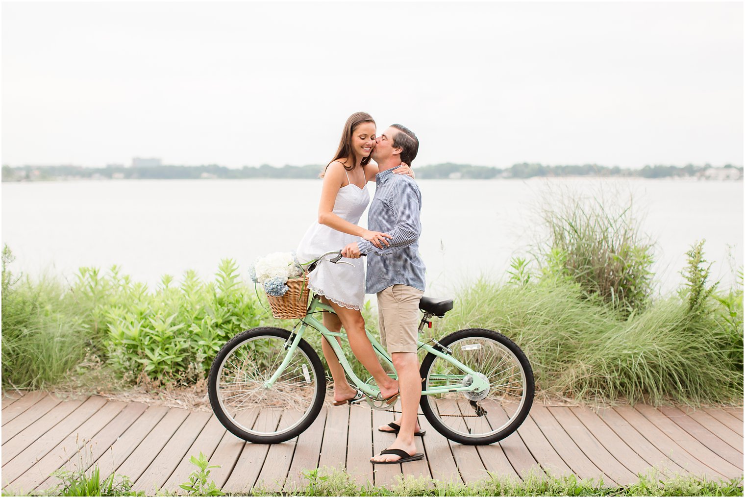 engaged couple on a bike