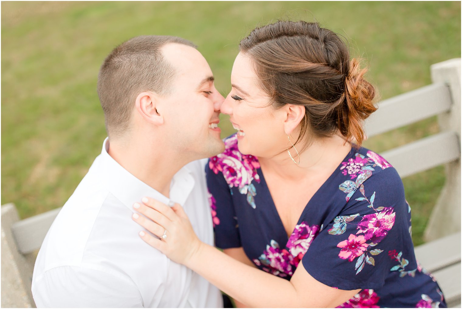 Photo of engaged couple laughing