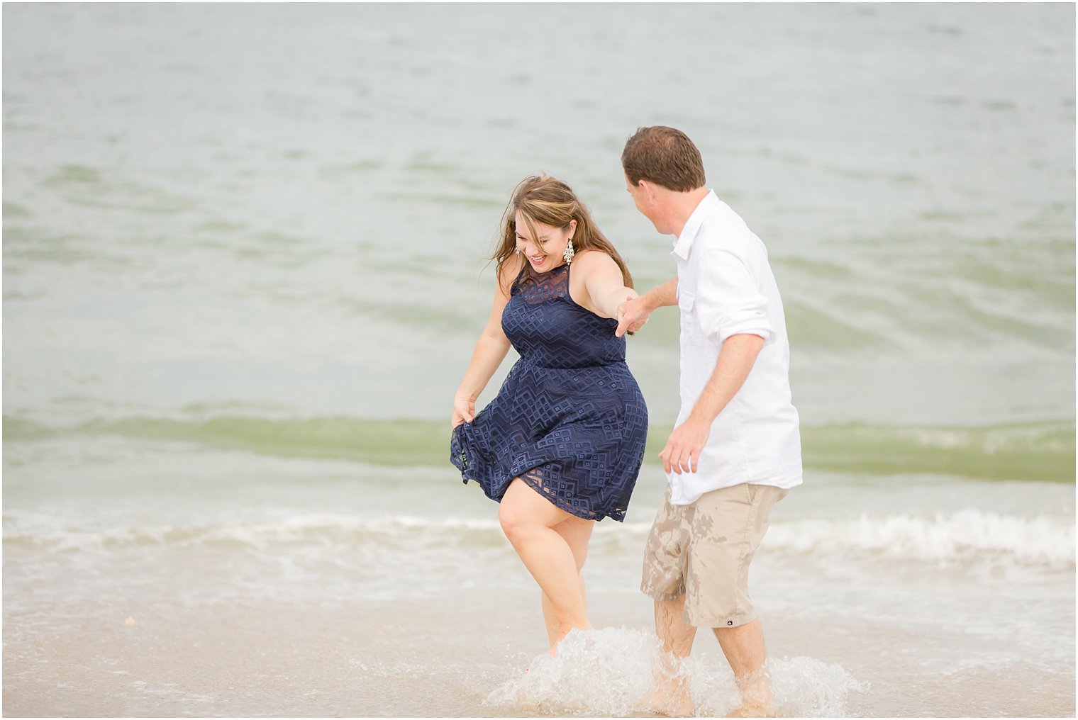 Couple frolicking in the ocean