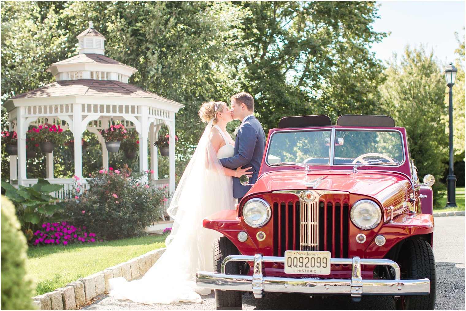 Bride and groom kissing in front if Windows on the Water at Frogbridge Wedding