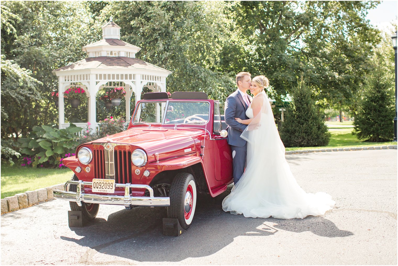 Romantic wedding photos with red antique Jeepster