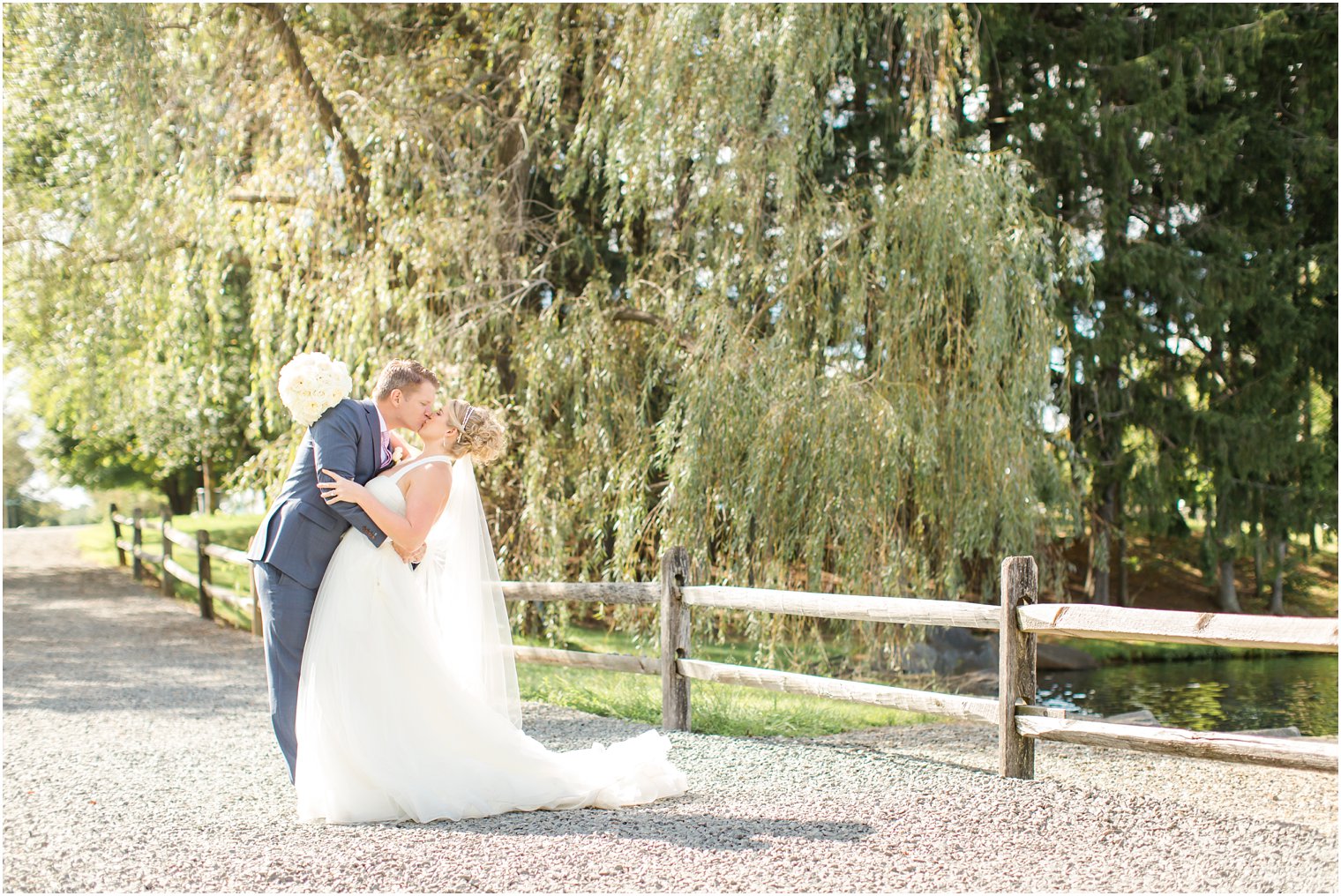 Groom dipping bride for wedding photo at Windows on the Water at Frogbridge Wedding