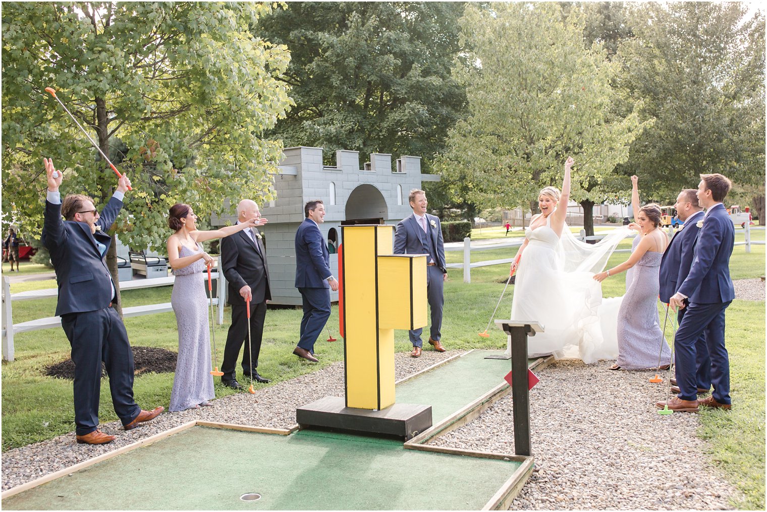 Bridal party playing golf at Windows on the Water at Frogbridge Wedding