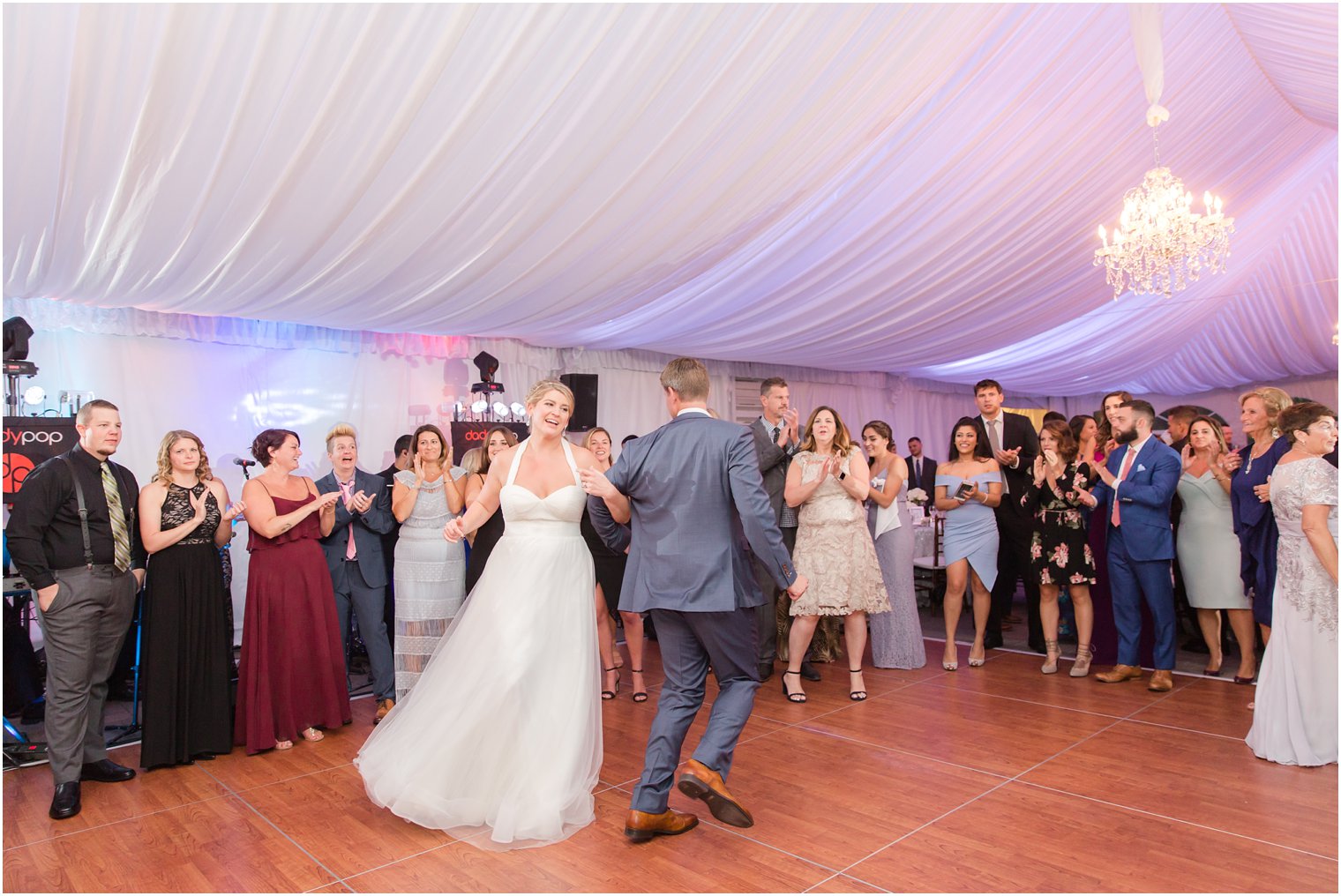 Bride and groom dance at Windows on the Water at Frogbridge tented wedding reception