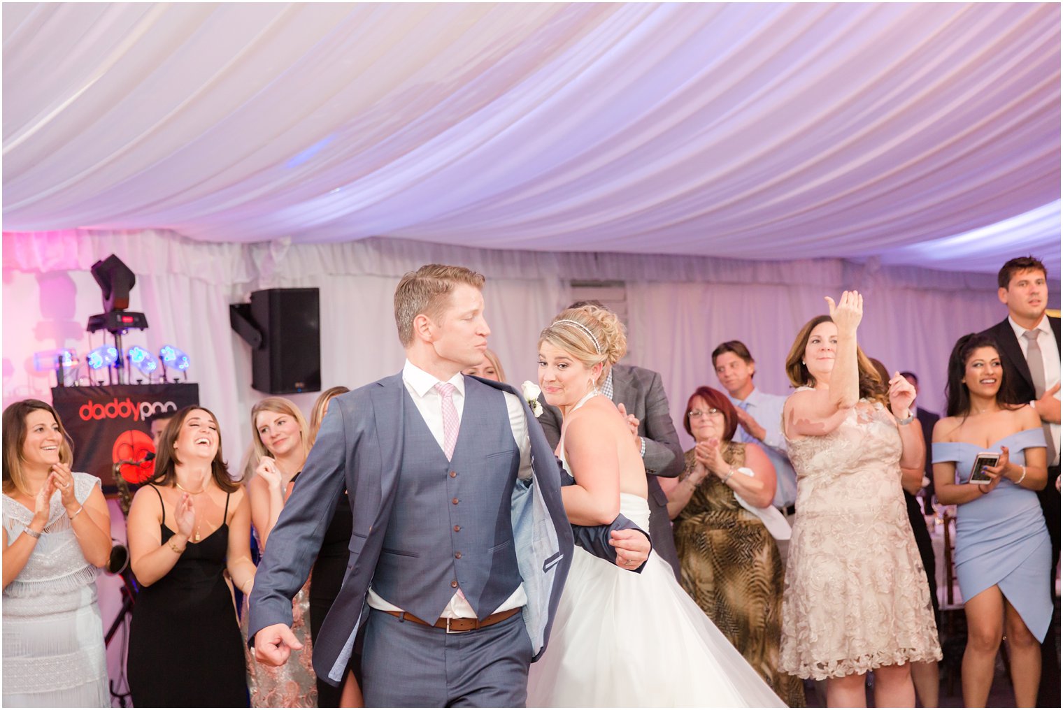 Candid moments at Windows on the Water at Frogbridge tented wedding reception