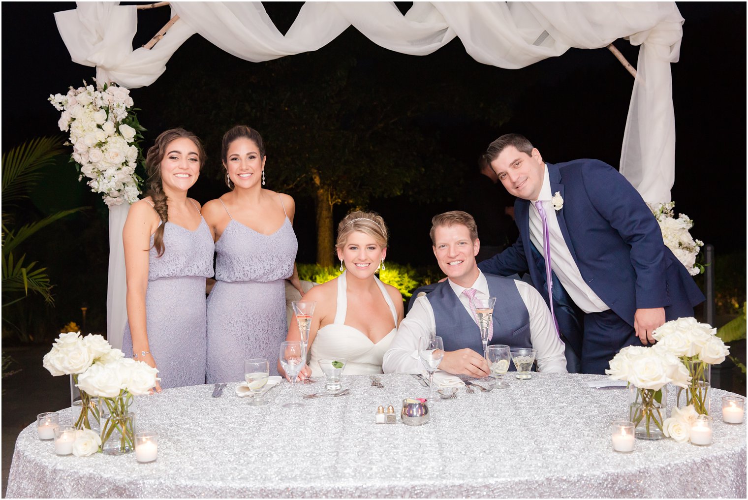 Maids of honor and best man photo at Windows on the Water at Frogbridge tented wedding reception