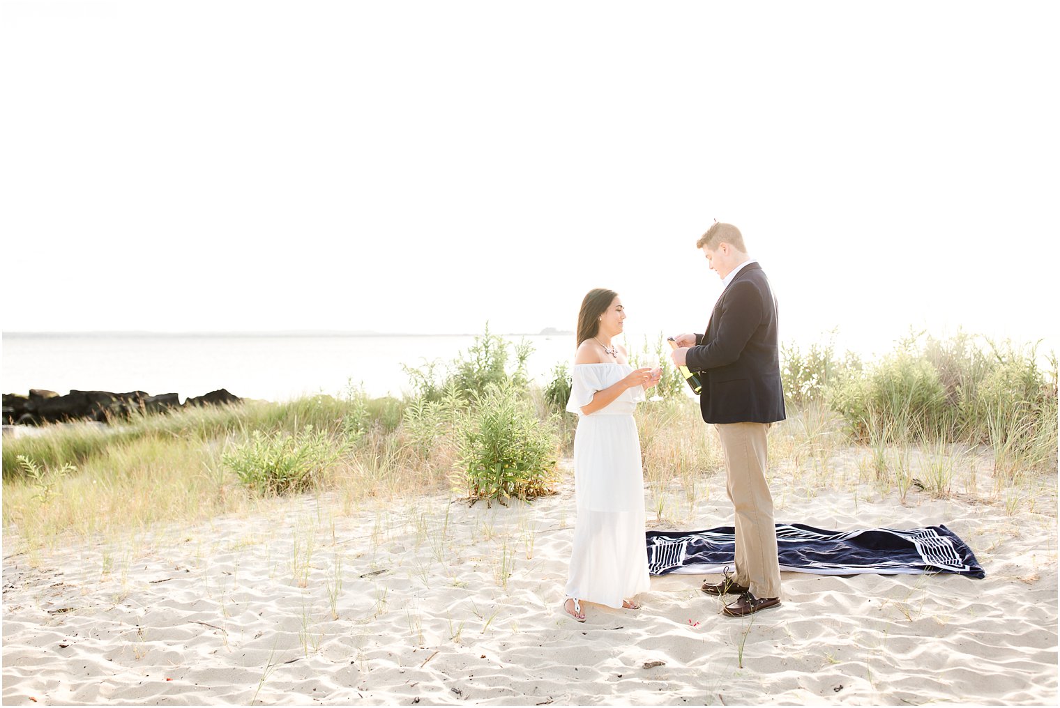 Romantic engagement photos with champagne