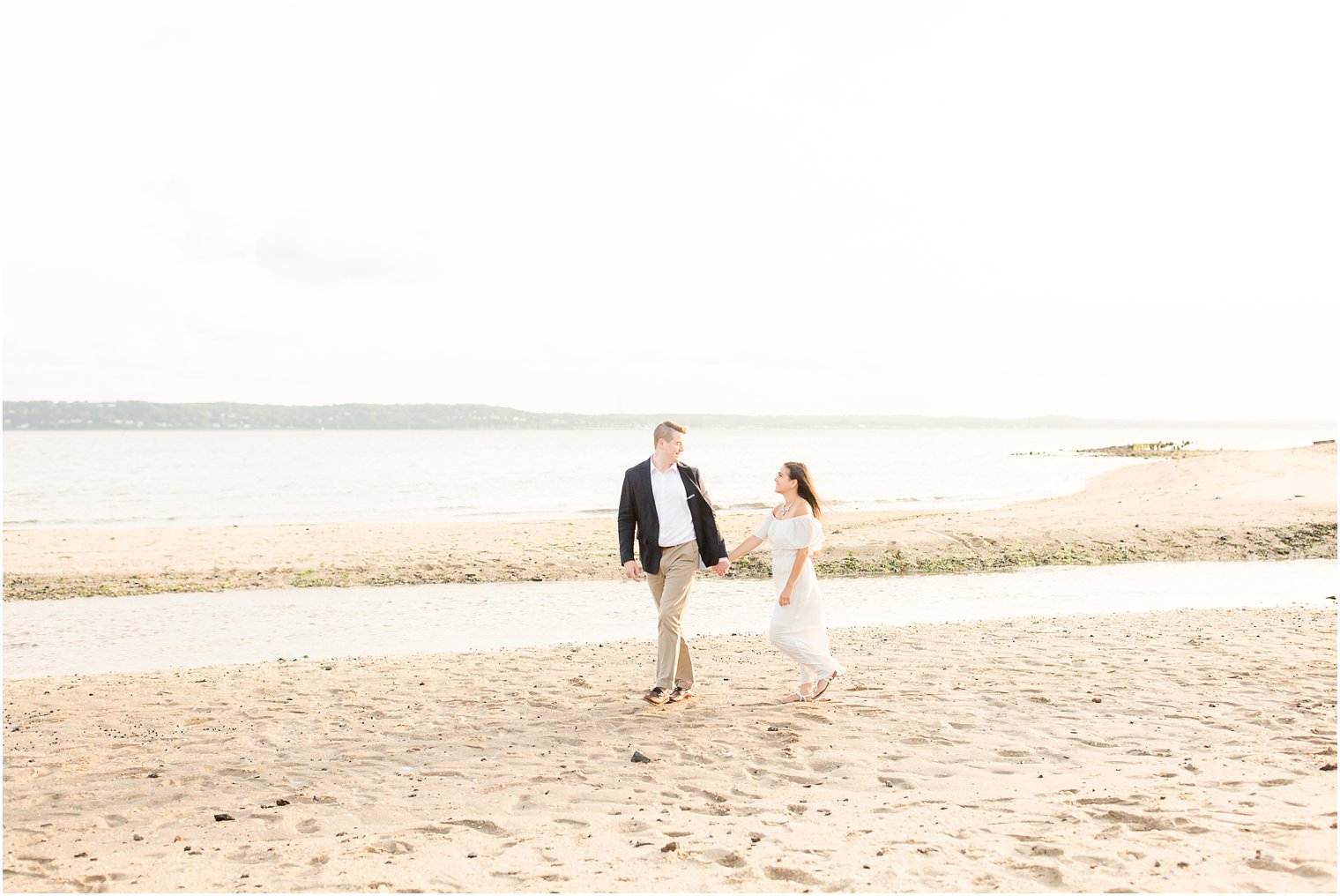 Romantic walk on beach | Engagement photos by Idalia Photography