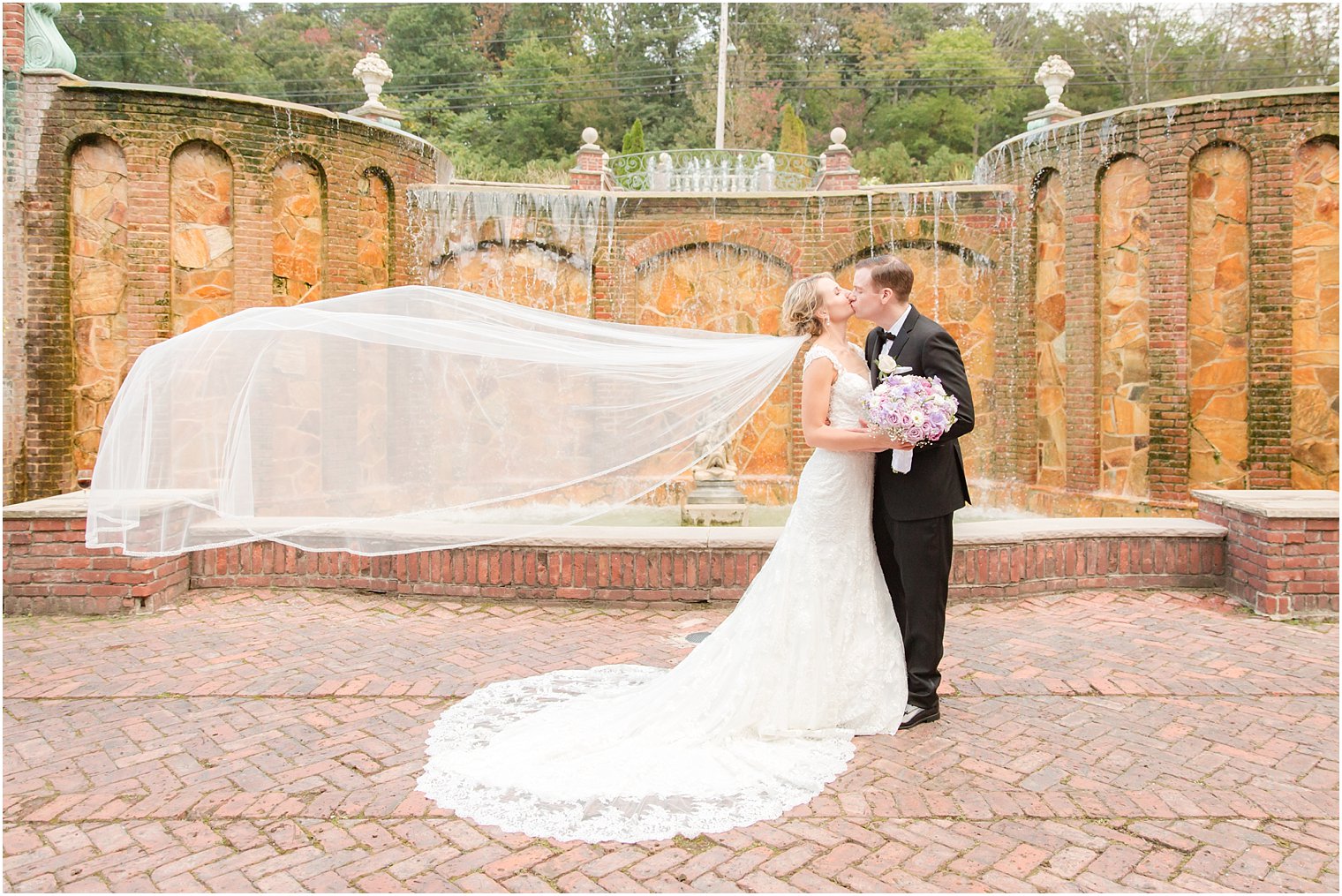 Romantic wedding photo with veil by Idalia Photography