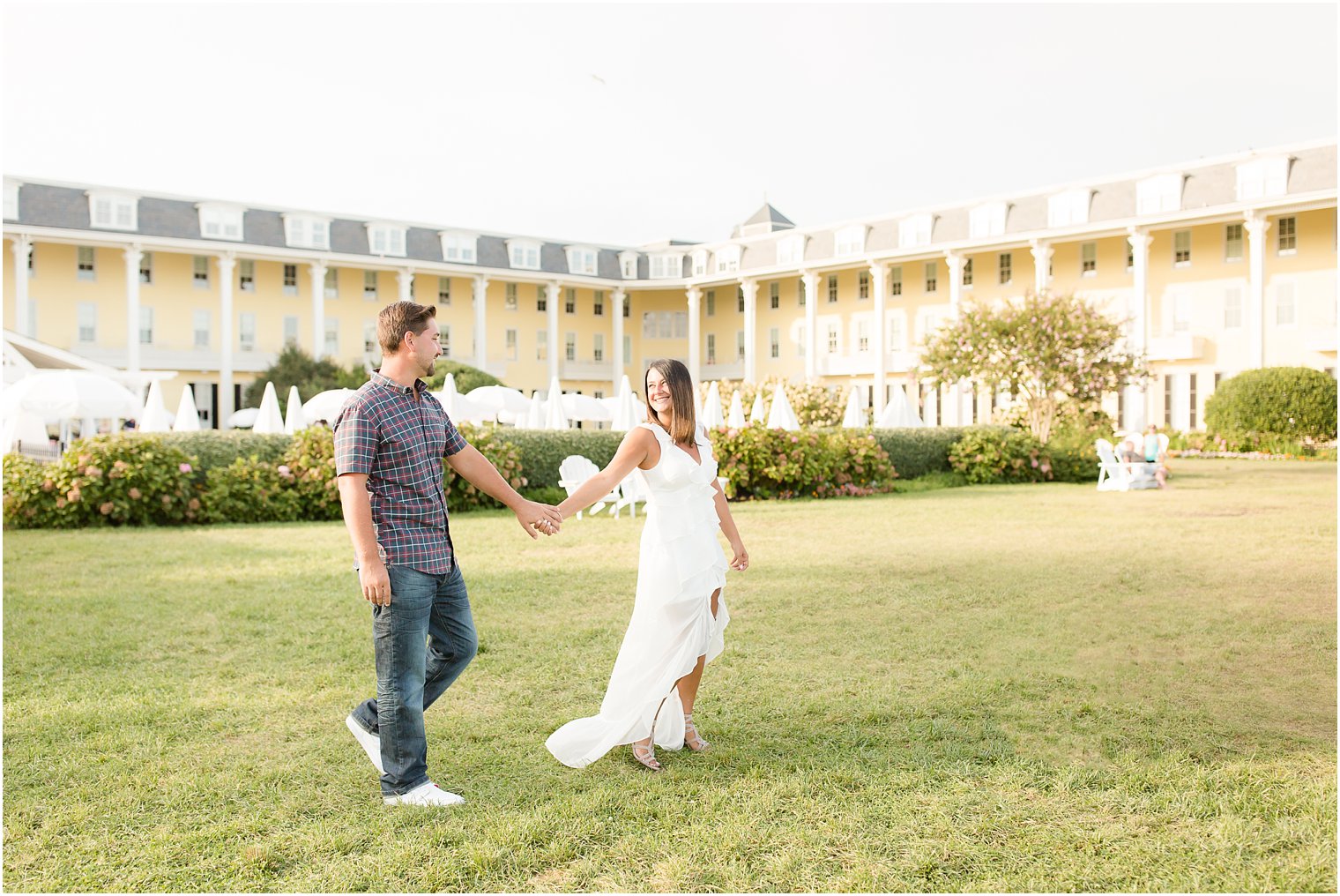 Couple walking on back lawn of Congress Hall in Cape May NJ