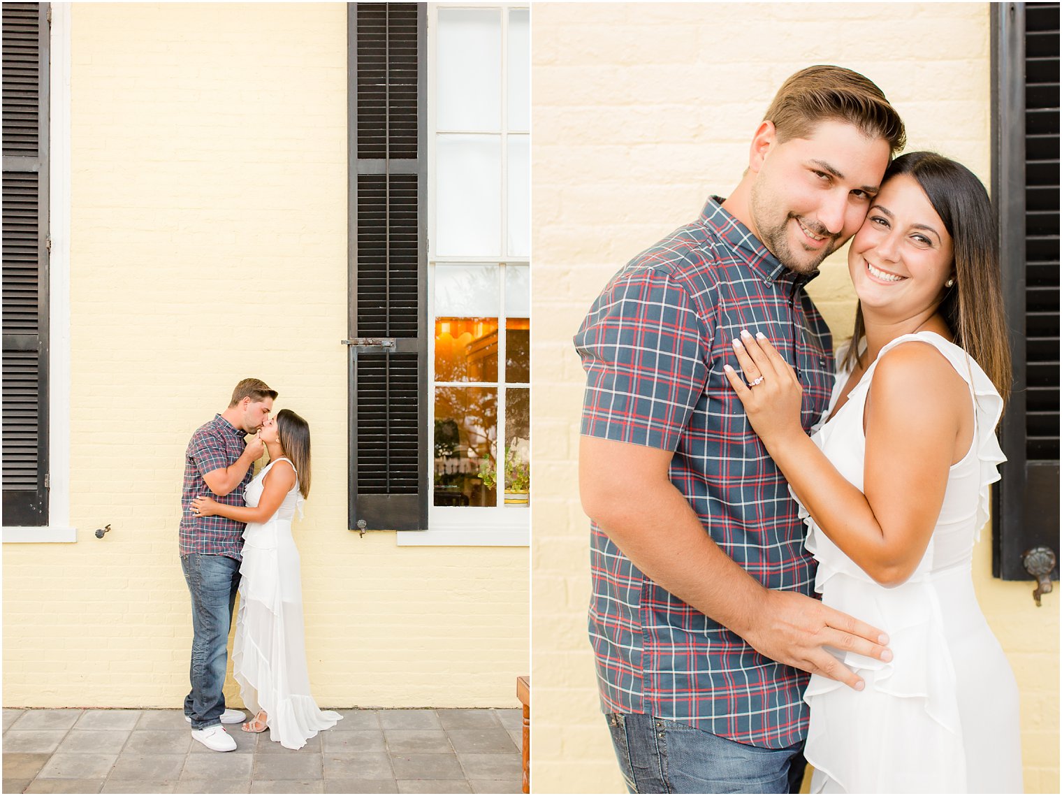 Engaged couple posing in front of yellow wall