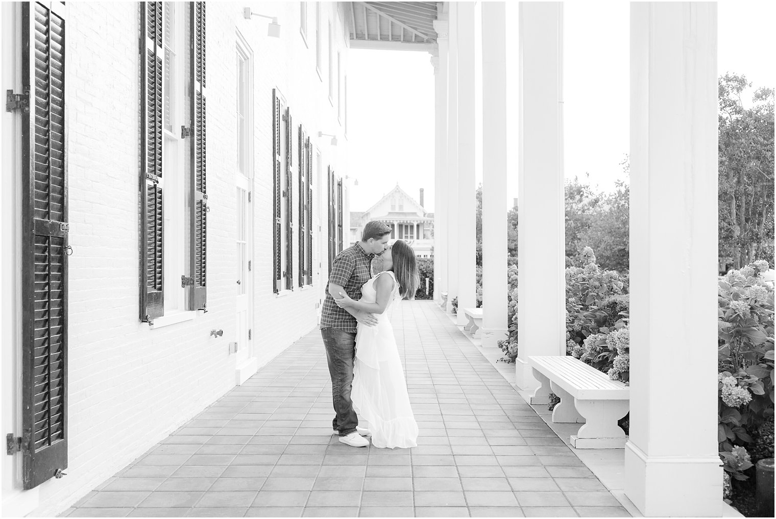 Engaged couple kissing at Congress Hall in Cape May, NJ