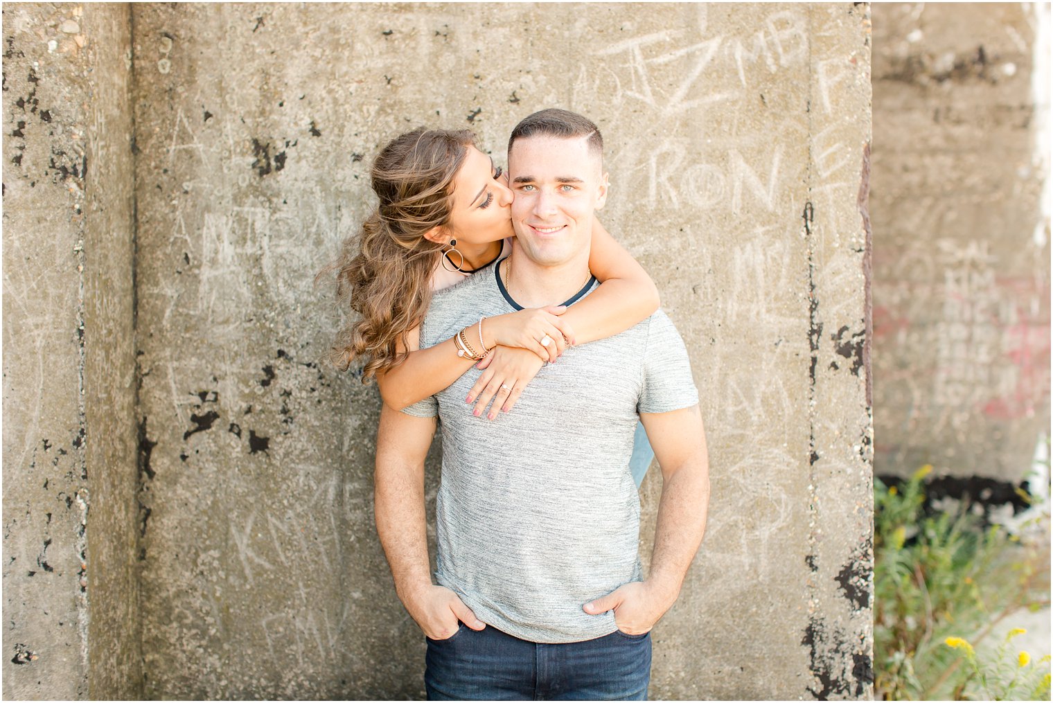 Bride kissing groom on cheek | Photos by Idalia Photography