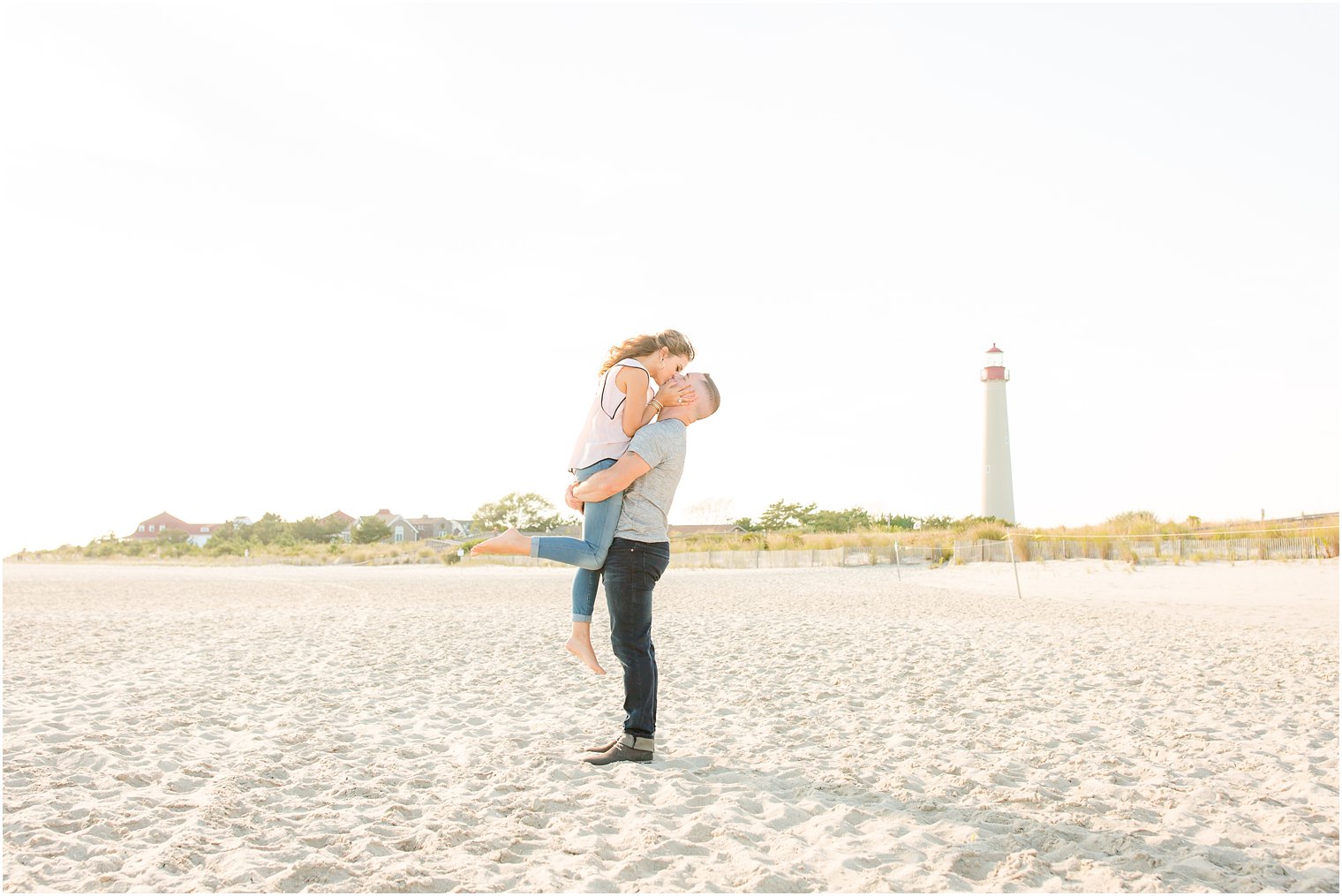 Groom lifts bride during engagement session | Photos by Idalia Photography