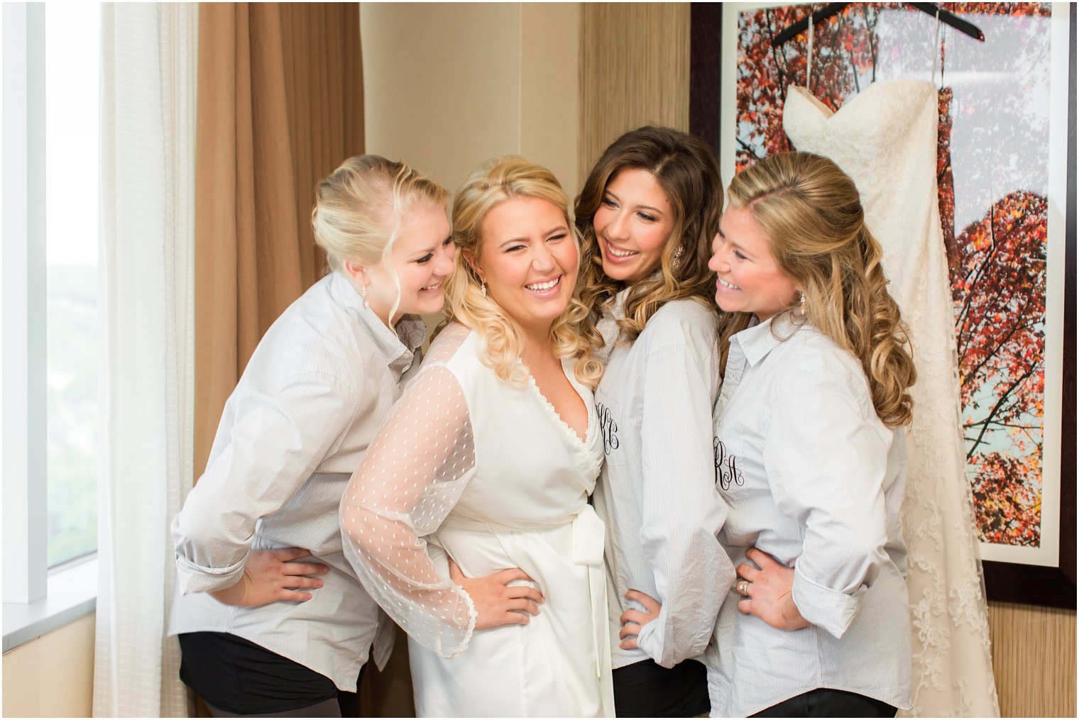 Bridesmaids in button down shirts for getting ready with bride