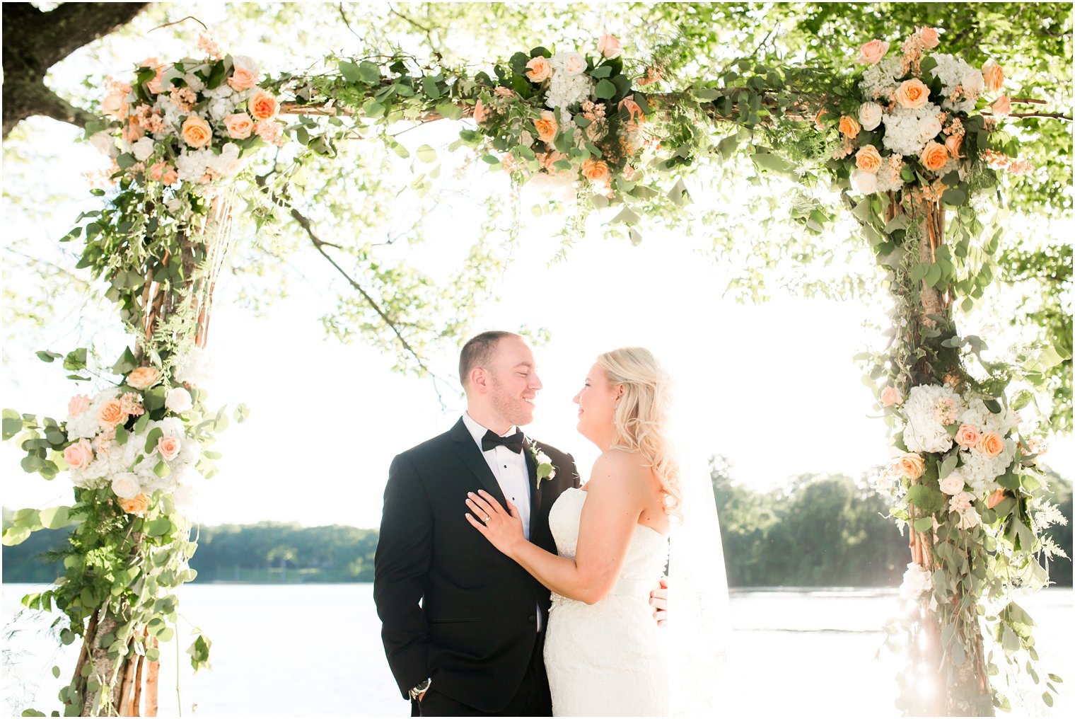 Ceremony arbor with florals | Photos by Indian Trail Club Wedding Photographer Idalia Photography