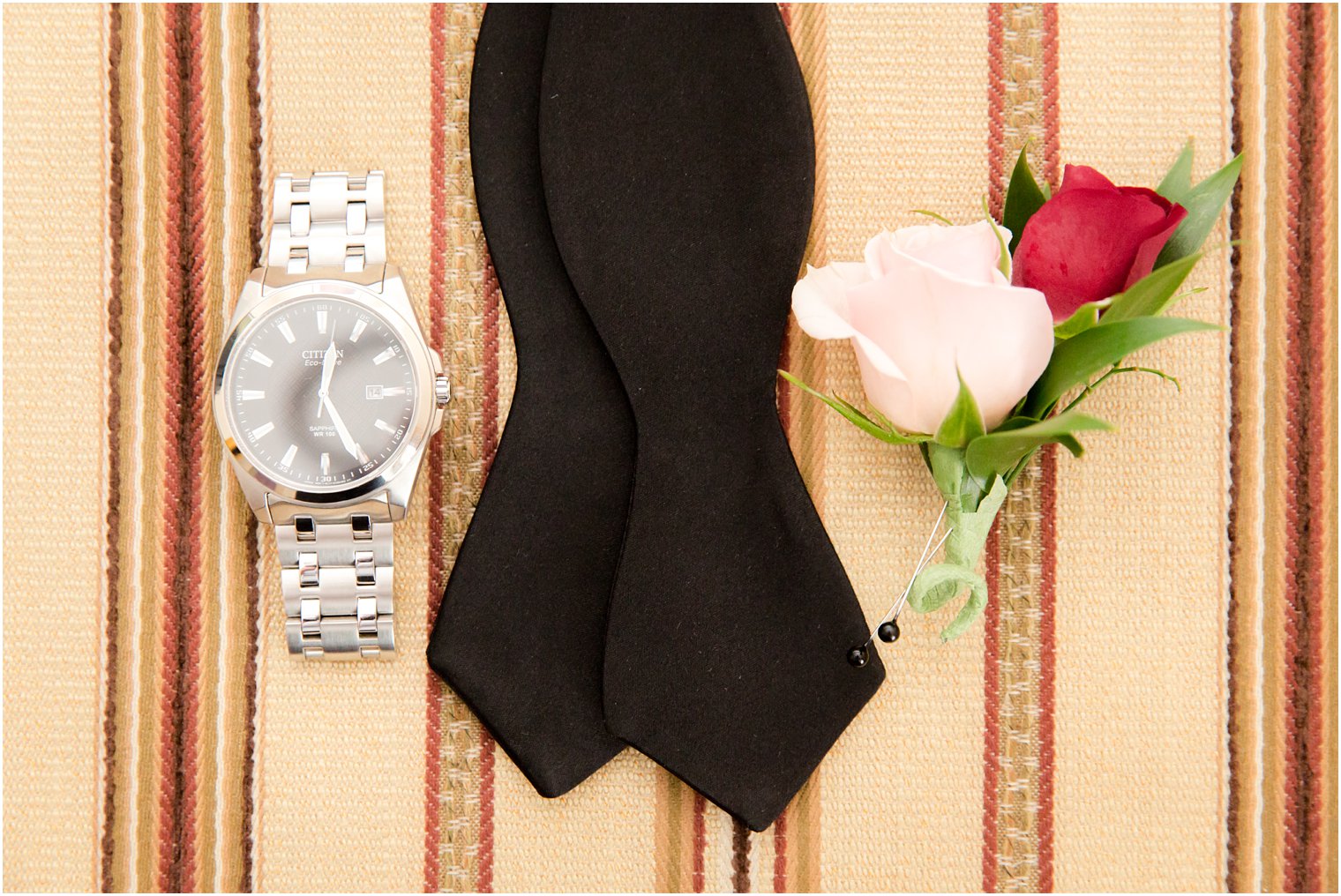 Groom's watch, bow tie, and boutonniere by Pod Shop Flowers