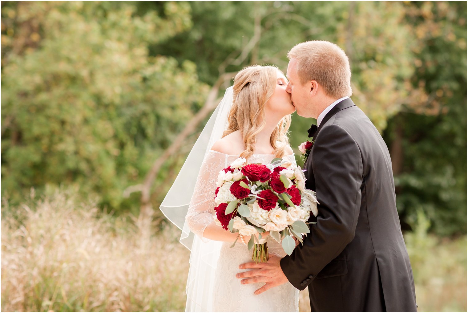 Bride and groom kissing 