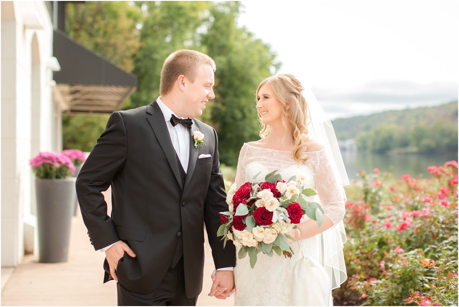 Bride and groom walking on patio of Lambertville Station Inn