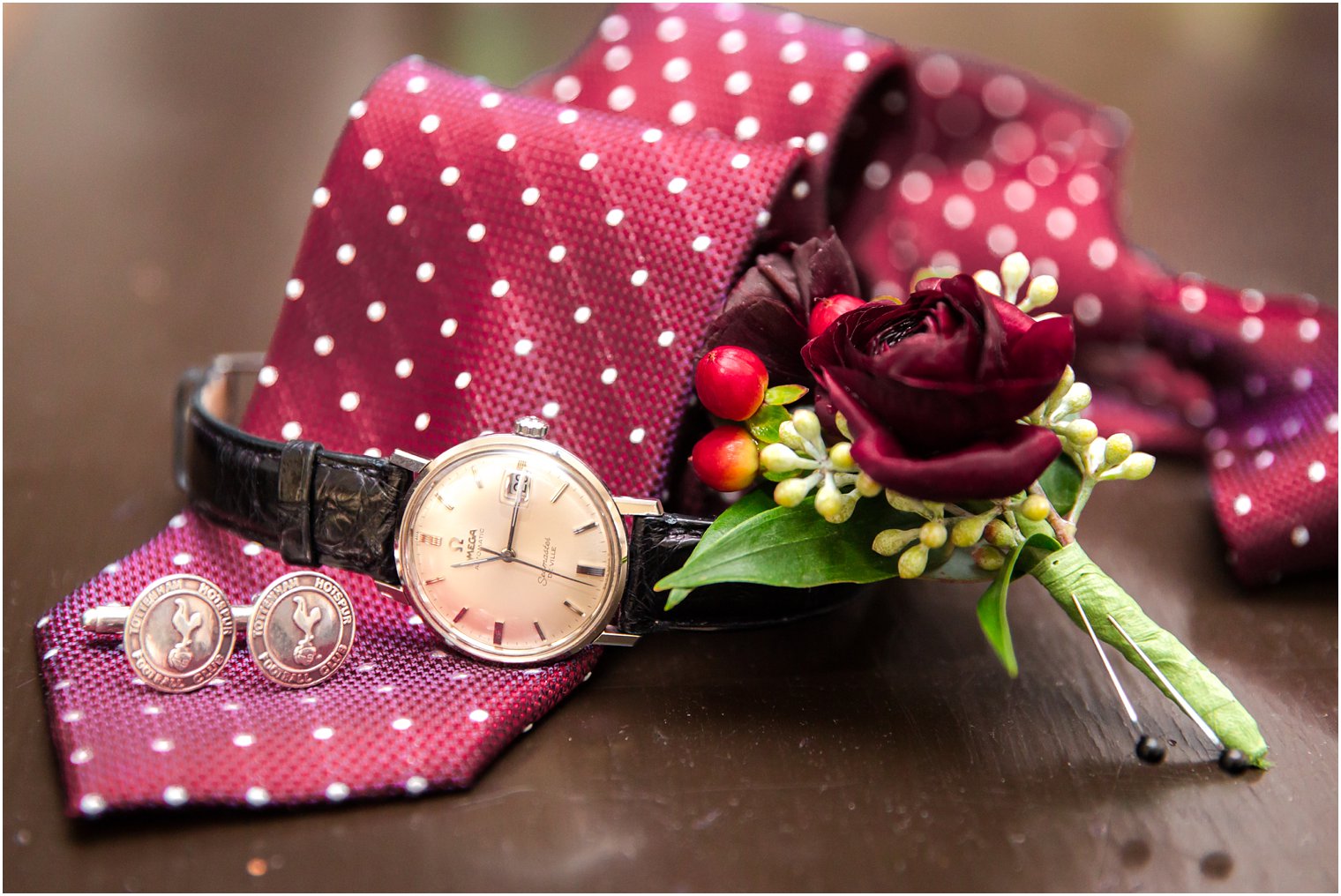 Burgundy tie with polka dots and burgundy boutonniere