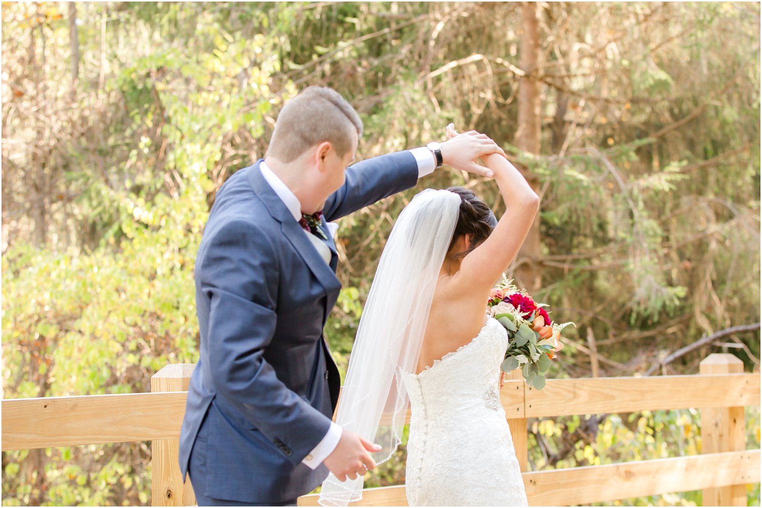 Groom twirling bride on their wedding day | Photos by NJ Wedding Photographers Idalia Photography