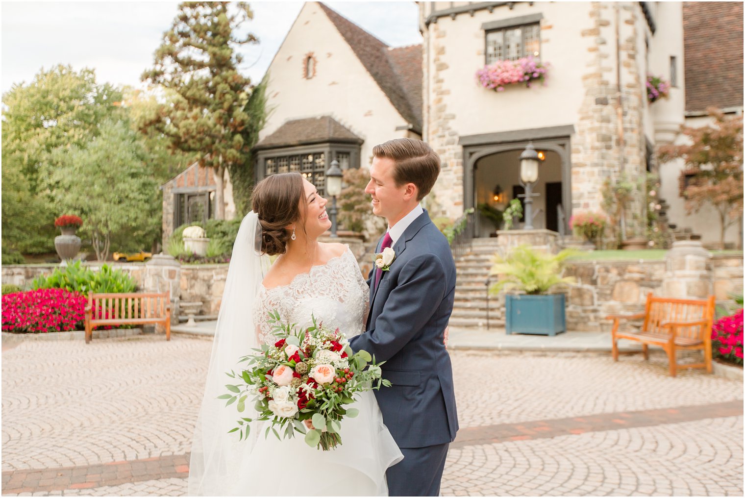 Bride and groom taking photos outside of Pleasantdale Chateau 