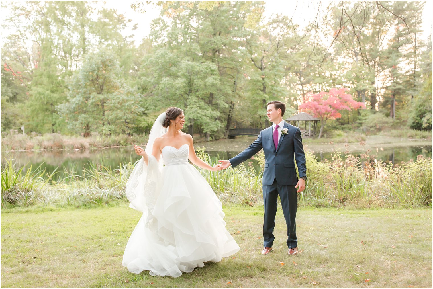 Bride and groom dancing on a fall day