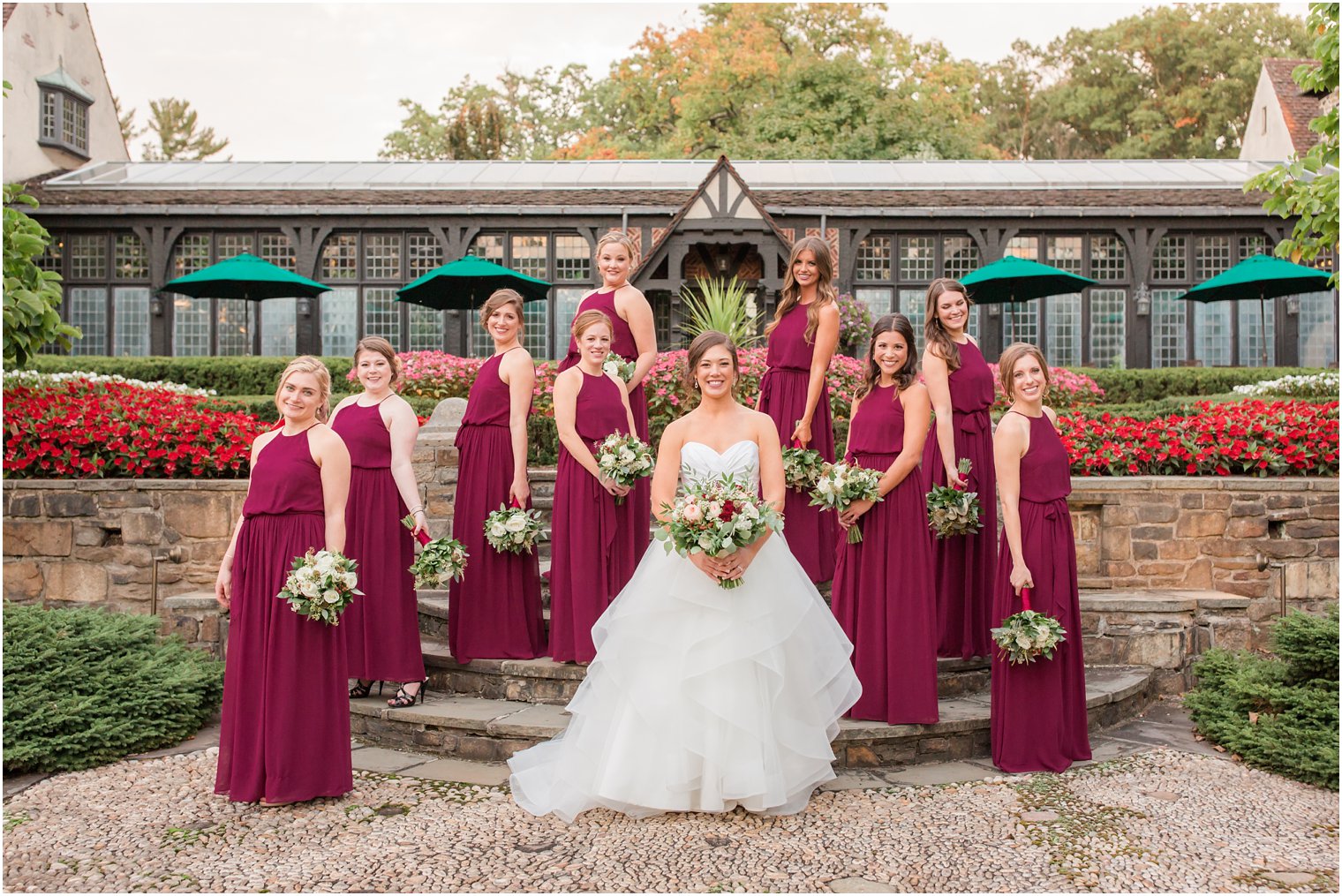 Bride and her bridesmaids posing in front of Pleasantdale Chateau
