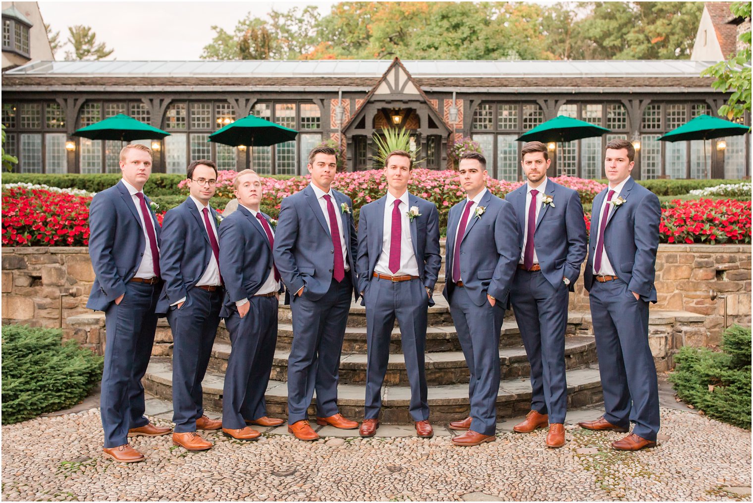 Grooom and groomsmen wearing blue and burgundy