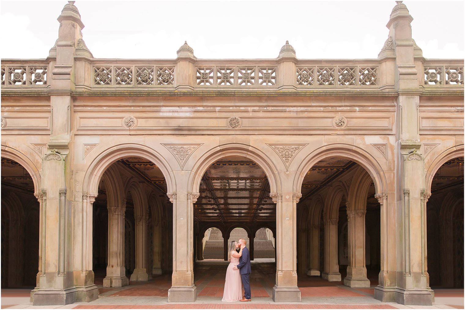 Romantic kiss photo at Central Park Bethesda Terrace