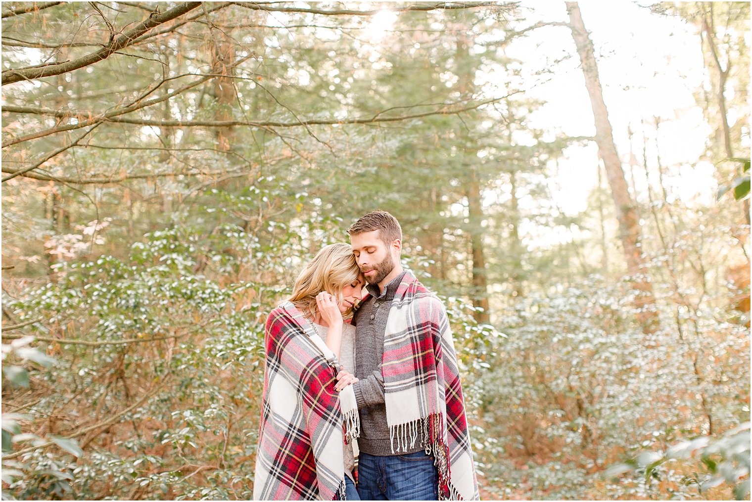 Engagement posing idea with plaid blanket