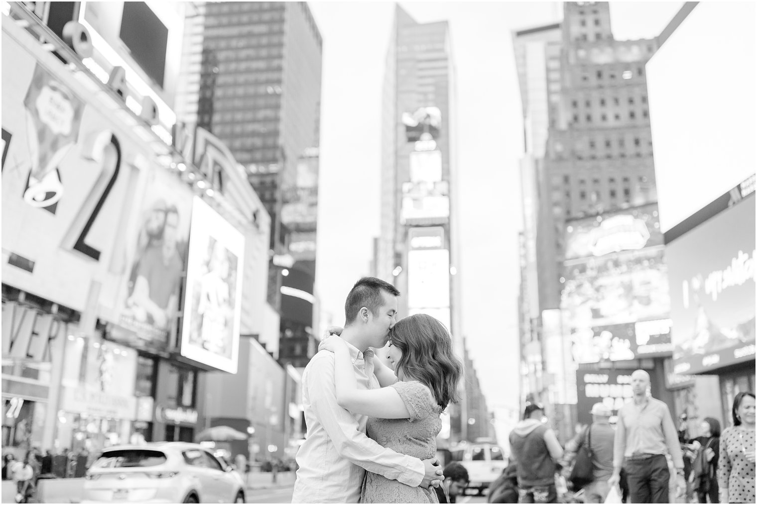 Romantic photo of engaged couple in Times Square by Idalia Photography