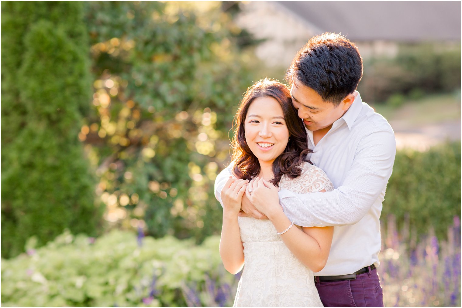 Engaged couple in backlit image