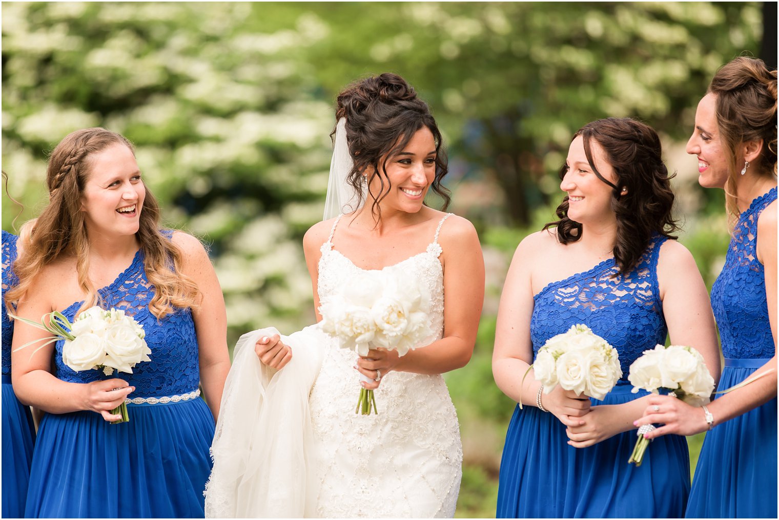 Candid photo of bride and bridesmaids | il Tulipano Wedding