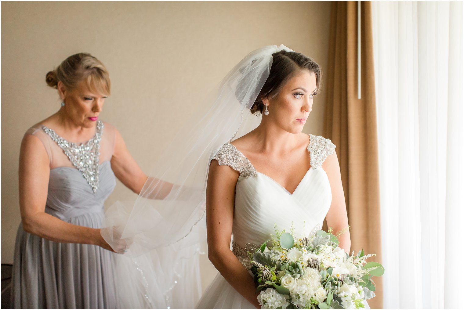 Bride getting ready with her mother | Windows on the Water at Frogbridge Wedding