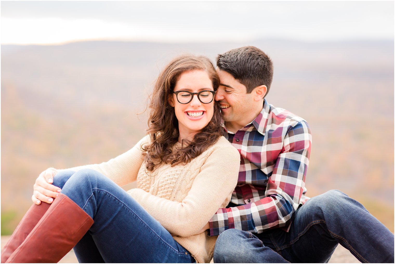 Groom whispering in bride's ears