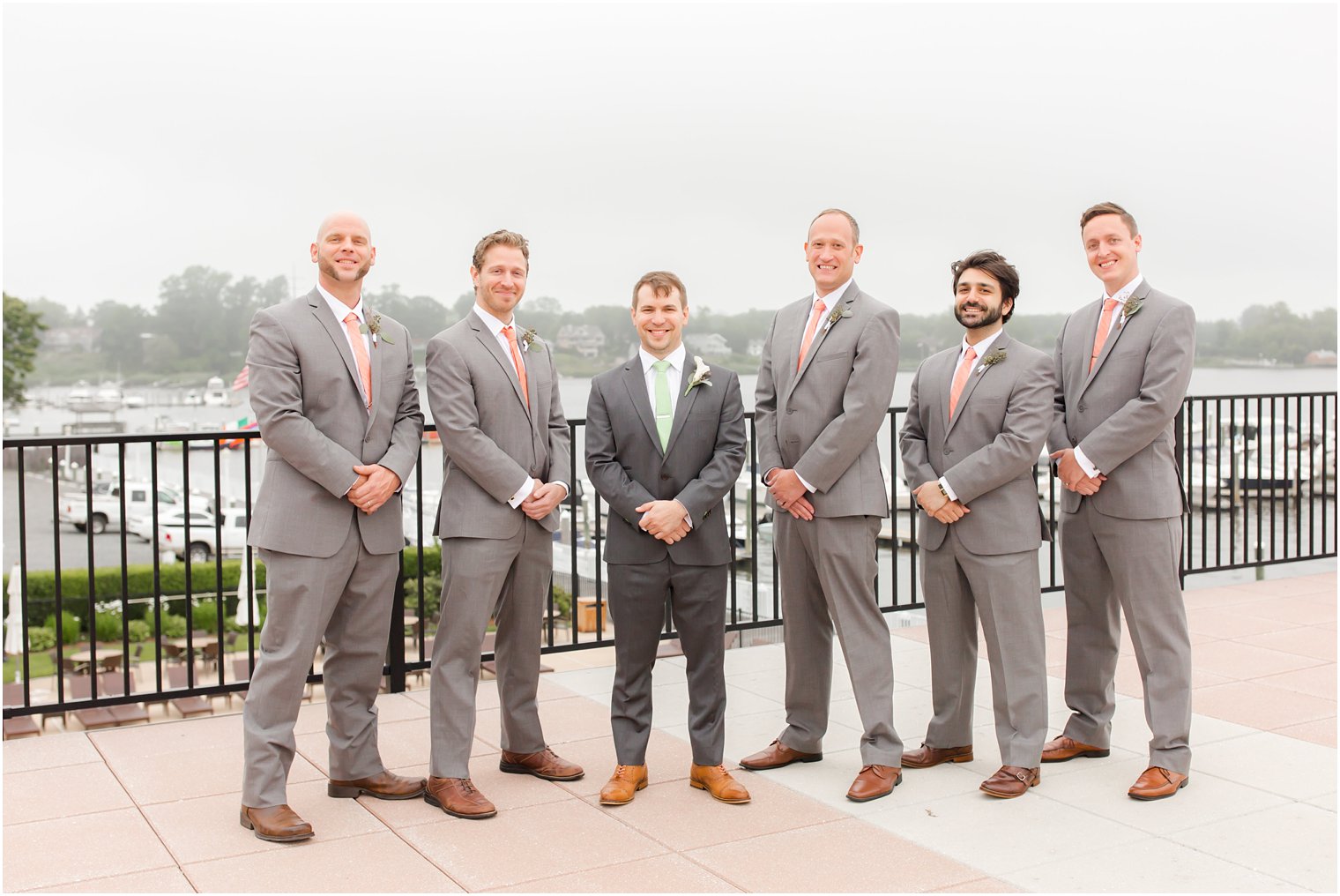 Groomsmen wearing gray and peach