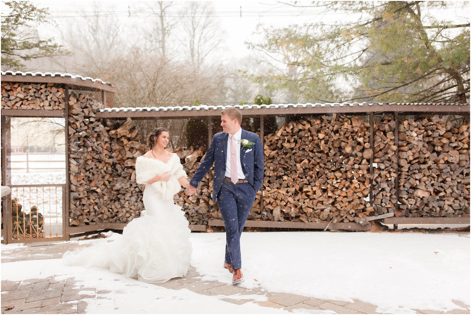 Snowy winter portraits of bride and groom at Stone House at Stirling Ridge in Warren, NJ