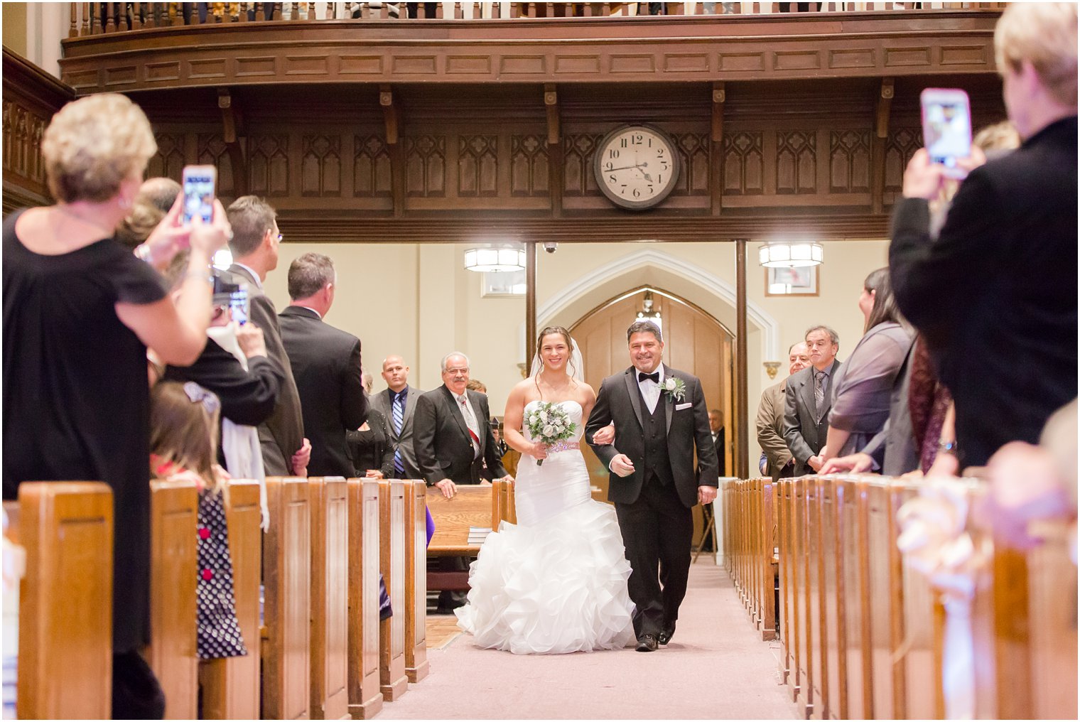 Bride walking down the aisle at Wedding ceremony at St. Peter the Apostle in New Brunswick, NJ