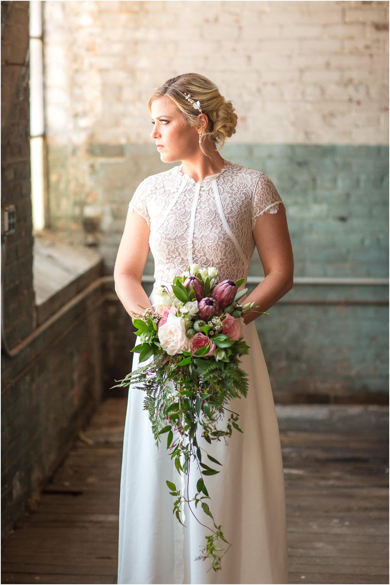 Bride wearing lace cream dress