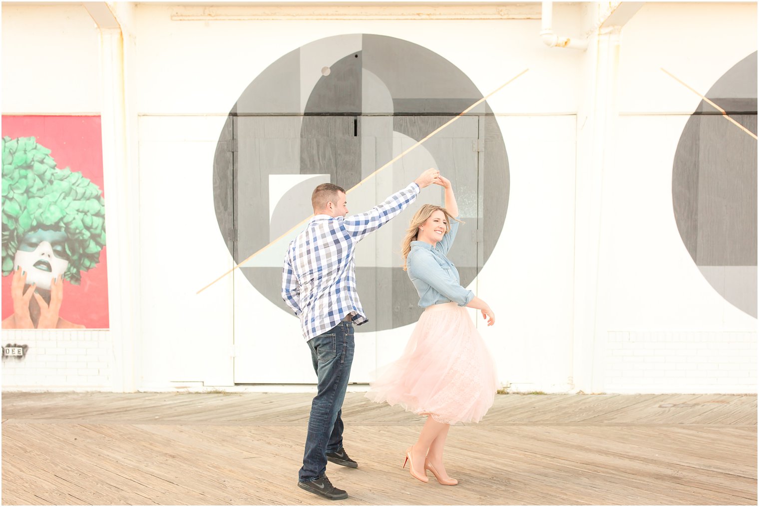 Candid twirling photo of bride in tulle skirt