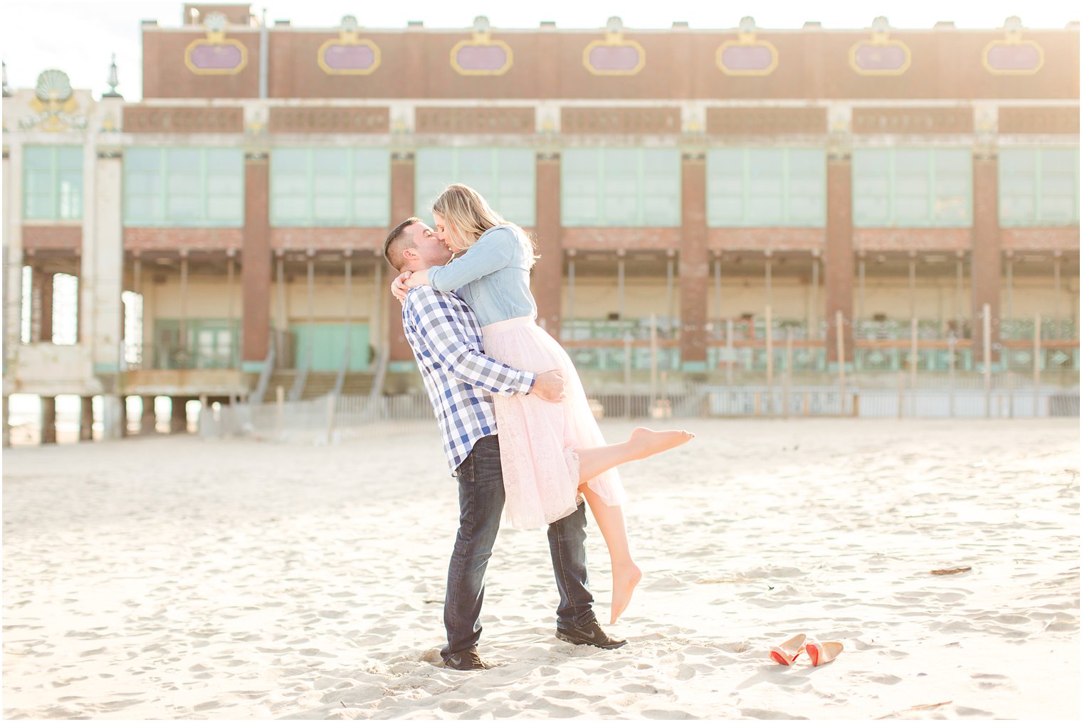 Groom lifting bride for engagement photo