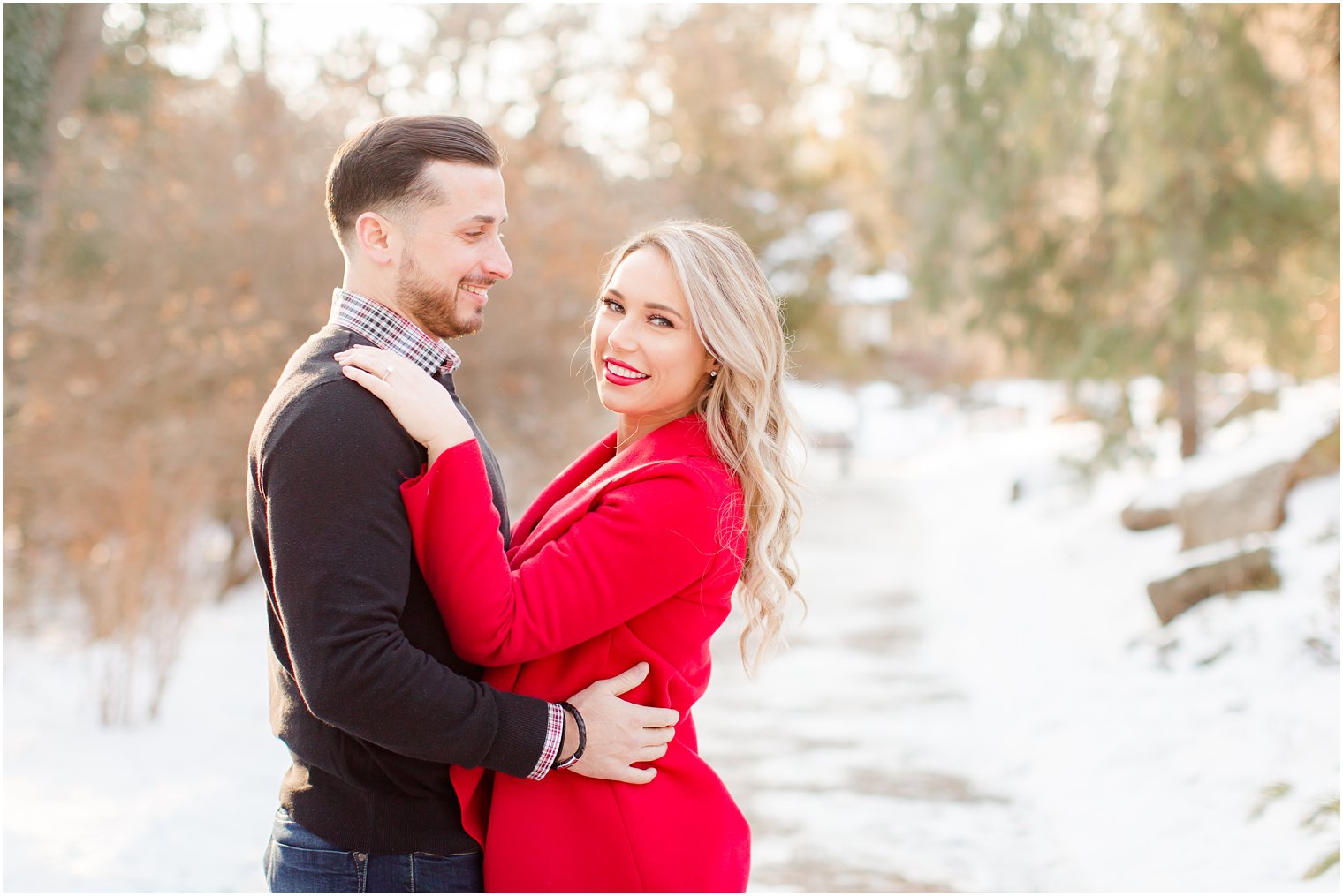 Engagement session with a red coat