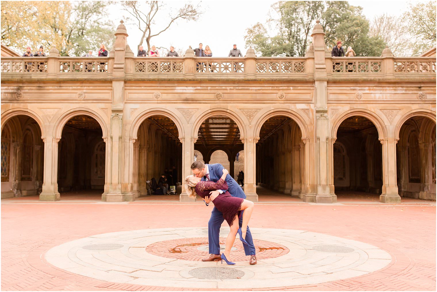 photo of tourists watching a romantic moment between a couple