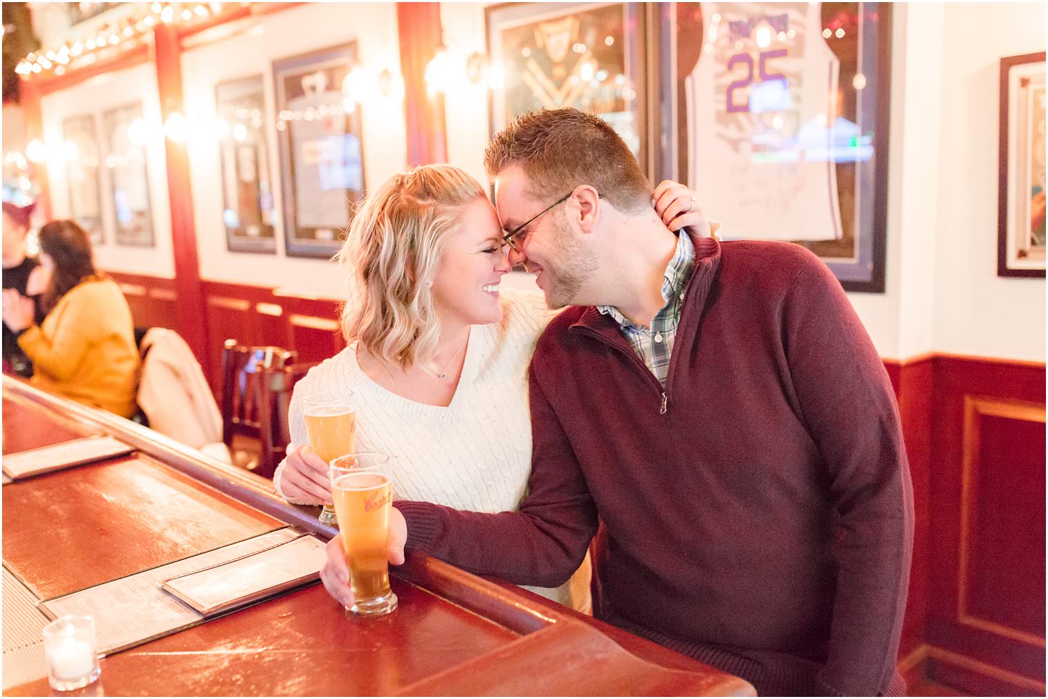 engaged couple drinking a bear at The Australian