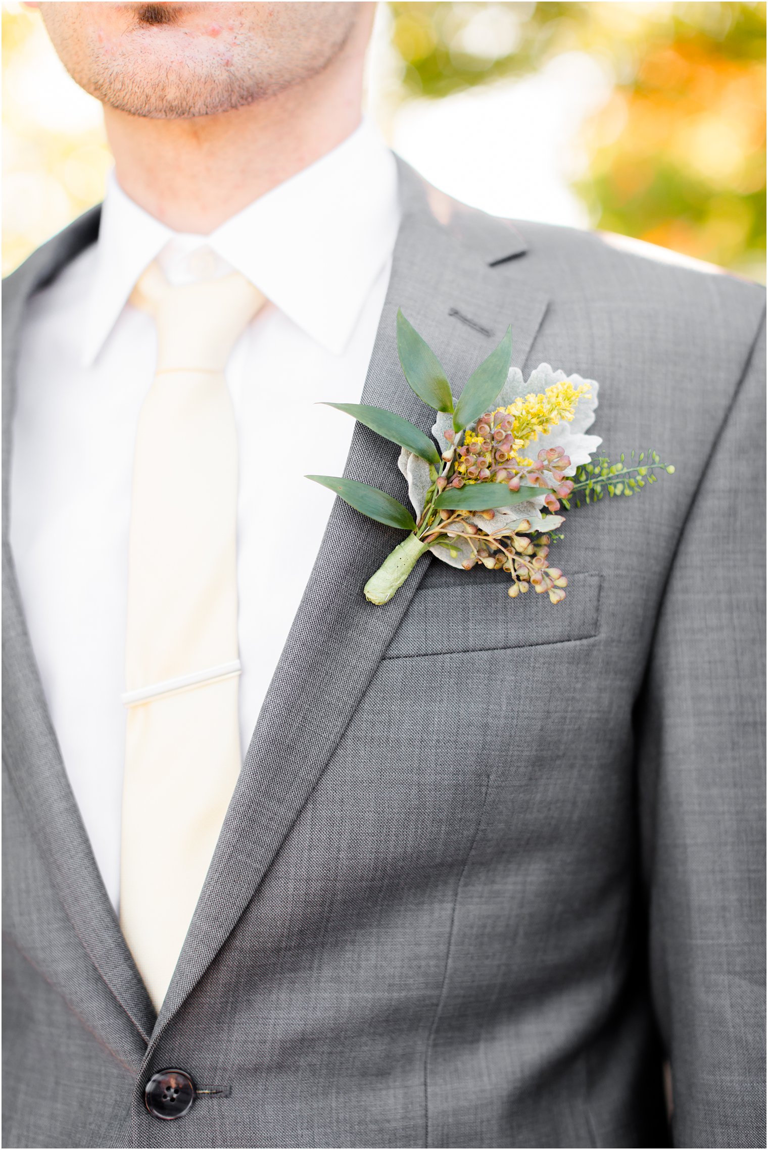 groomsman boutonniere for yellow and gray wedding